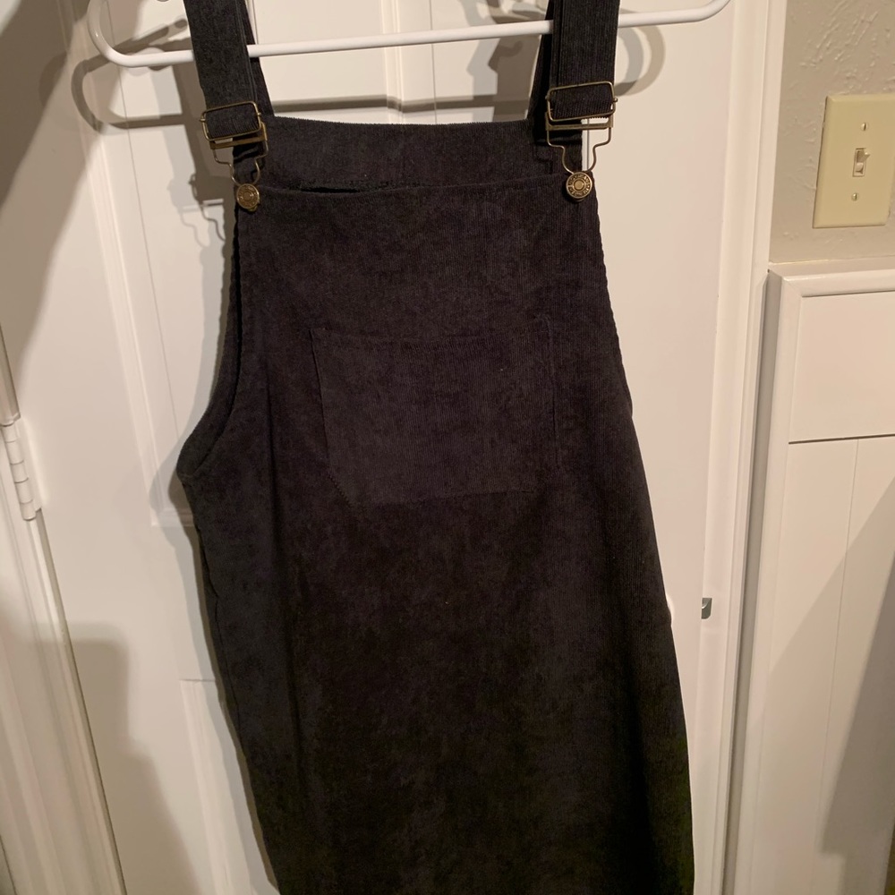 black corduroy overall-like dress with pockets